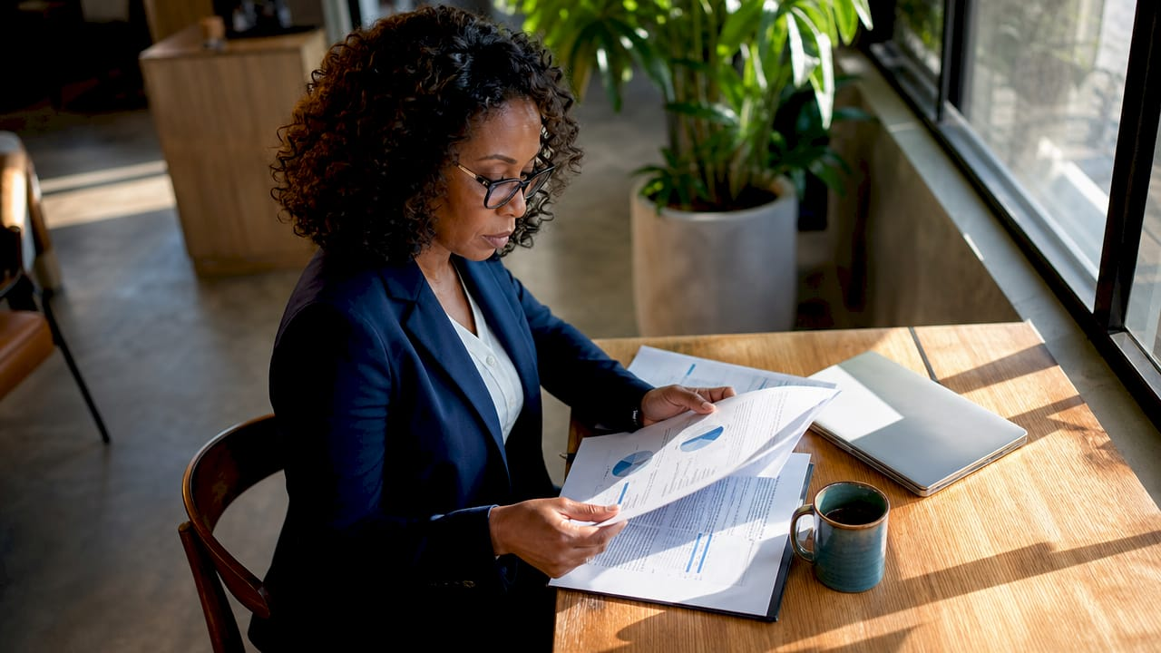 Businesswoman reviewing financial reports